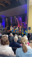 Live music performance with Swedish flags held in Karlstad