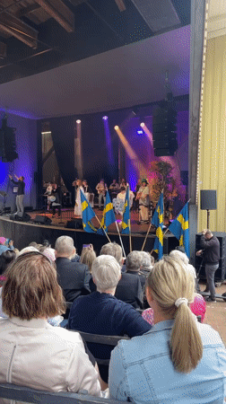 Live music performance with Swedish flags held in Karlstad