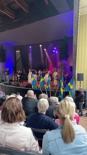Live music performance with Swedish flags held in Karlstad