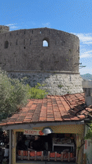 Tourist documents afternoon scenes in historic Stari Bar, Montenegro