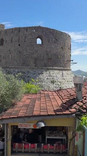 Tourist documents afternoon scenes in historic Stari Bar, Montenegro