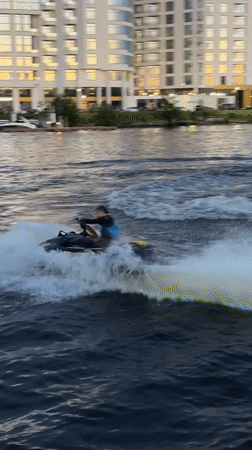 Jet skis, river boats, and bouldering on a Saint Petersburg evening