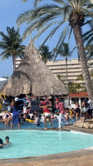 Foam pool party at a Porlamar venue, stage, crowd, sun.