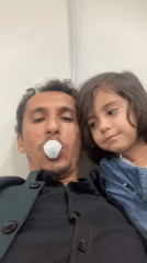 Father and daughter share playful selfie moment in Quetta