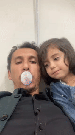 Father and daughter share playful selfie moment in Quetta