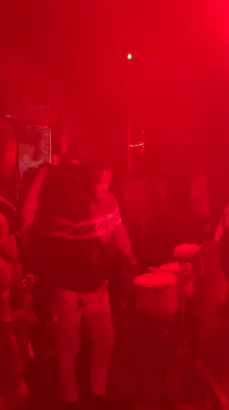 Late-night club scene in Abuja, live drums and dancing