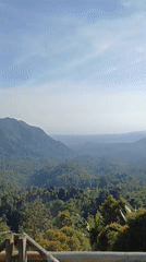 Woman visits scenic mountain viewpoint in Sawan, Indonesia