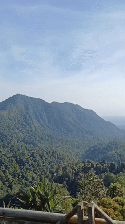 Woman visits scenic mountain viewpoint in Sawan, Indonesia