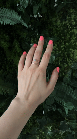Pink nails, two rings, and a vape in Riga