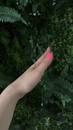 Pink nails, two rings, and a vape in Riga