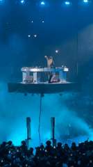 DJ performs on suspended floating platform in Paris