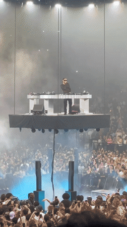 DJ performs on suspended floating platform in Paris