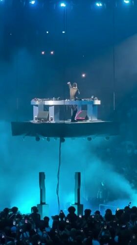 DJ performs on suspended floating platform in Paris