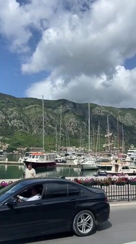 Morning harbor life documented in historic Kotor, Montenegro
