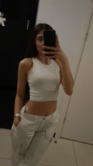 Woman takes mirror selfies in Chaikovsky fitting room
