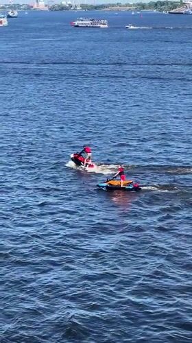 Jet skis, sailboats, and a passenger ferry on the Nizhny Novgorod river