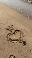Dog discovers heart drawing on Spanish beach