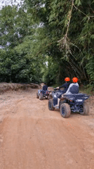 Off-road vehicle group rides dirt road in Ko Samui