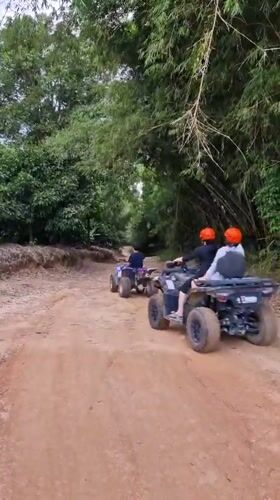 Off-road vehicle group rides dirt road in Ko Samui