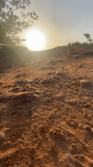 Early morning walk with fishing gear in rural Nigeria