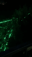 Night party with laser lights and balloons near Russian cityscape