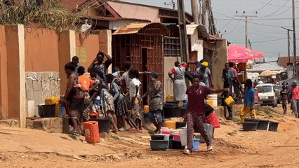 Daily urban life: water collection, shopping, street markets documented