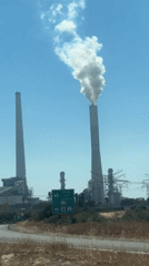 Industrial smokestack emits white smoke in Hadera, Israel