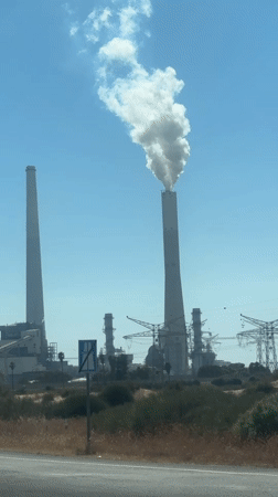 Industrial smokestack emits white smoke in Hadera, Israel