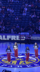 Dance troupe performs on basketball court in Los Angeles stadium