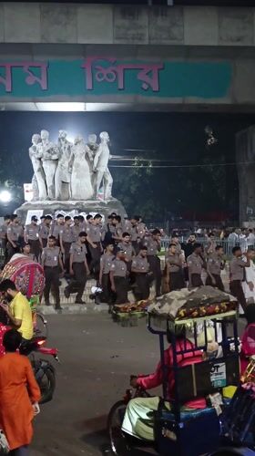 Evening crowds and rickshaws captured in central Dhaka