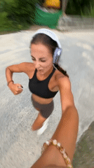 Woman films herself jogging on road in Chalong Thailand