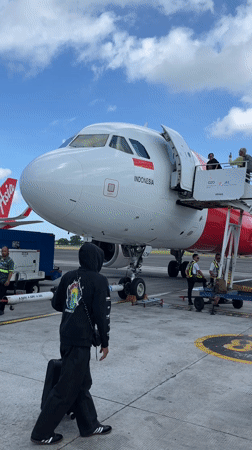 AirAsia Indonesia flight operations captured at Kuta airport