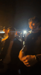 Outdoor nighttime party with DJ draws dancing crowd in Thessaloniki