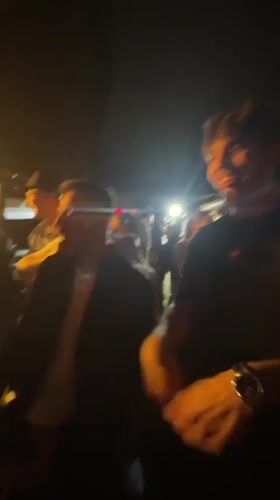 Outdoor nighttime party with DJ draws dancing crowd in Thessaloniki