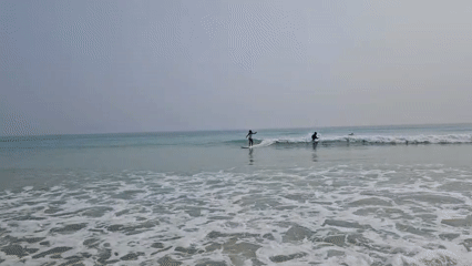 Early morning surfing session documented at Vietnam beach