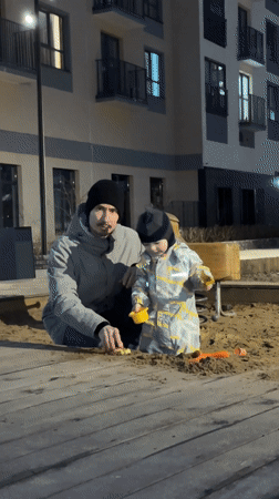Evening playground activities documented in Izhevsk residential area