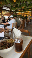 Casual café outing with food, notes, and a puppy