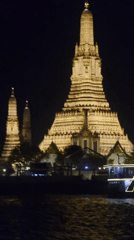 Nighttime Views of Illuminated Wat Arun Temple Documented in Bangkok