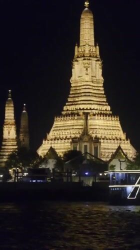 Nighttime Views of Illuminated Wat Arun Temple Documented in Bangkok