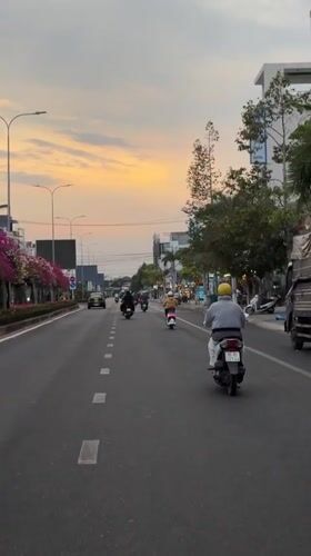Evening motorbike traffic captured in Vietnamese street scene