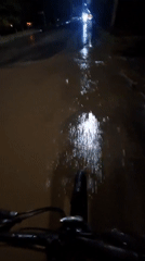 Cyclist rides through flooded streets in Kokshetau, Kazakhstan