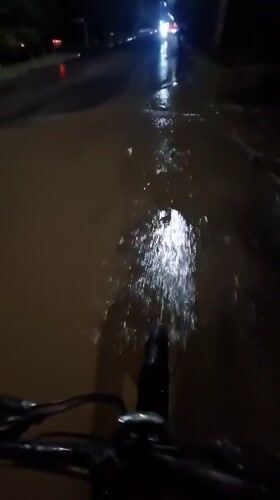 Cyclist rides through flooded streets in Kokshetau, Kazakhstan