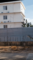 Building filmed from moving vehicle in Porlamar, Venezuela