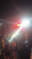 Late-night dancing crowd fills Arica nightclub with colorful lights