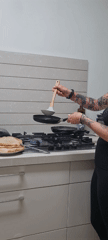 Woman makes crepes in Rishon LeZion kitchen