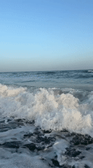 Sunset over the sea at Estepona, waves and golden light