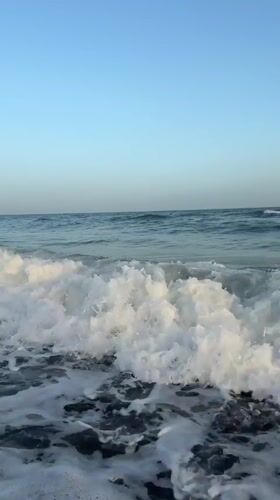 Sunset over the sea at Estepona, waves and golden light