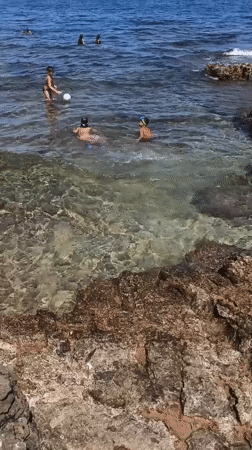 Summer morning on Molfetta's rocky Adriatic shore