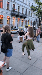 Evening street life unfolds across central Saint Petersburg landmarks