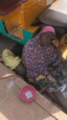 Women and child spotted near tricycle in Bukuru, Nigeria